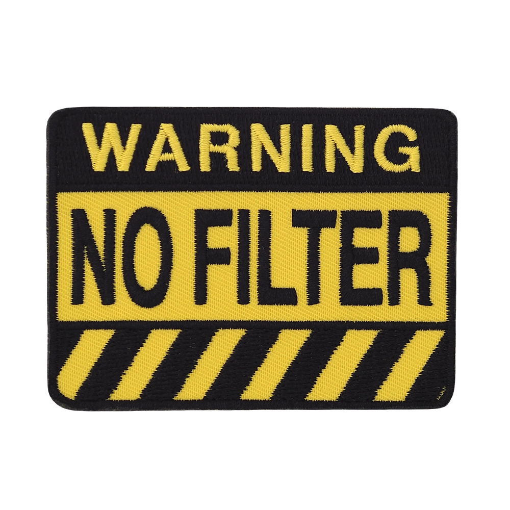 Brodeerattu kangasmerkki, teksti: Warning, no filter.