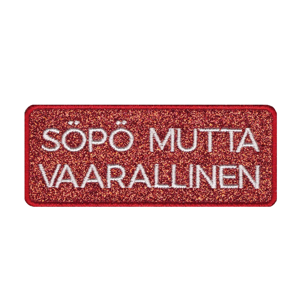 Brodeerattu glittermerkki, teksti: Söpö mutta vaarallinen.
