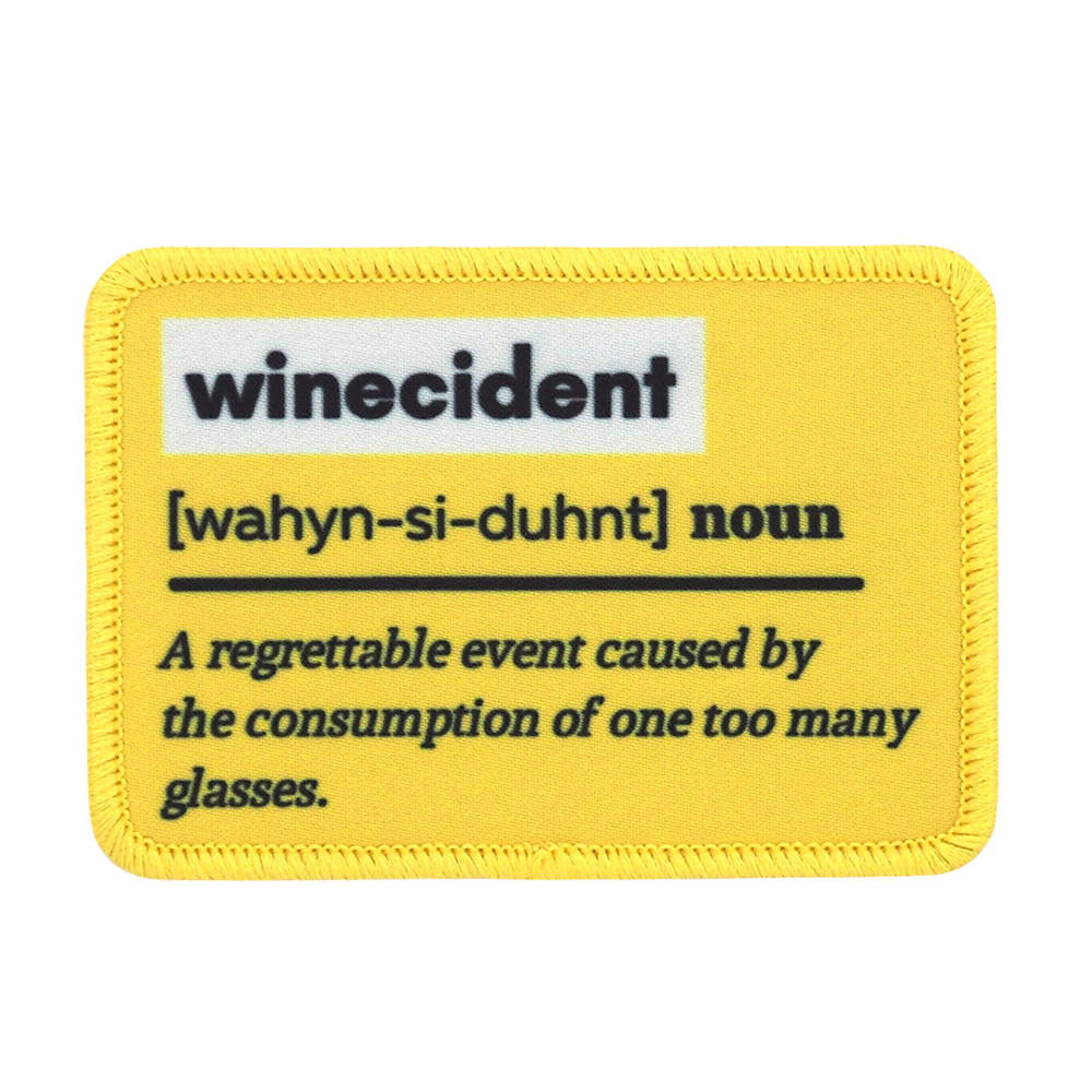 Painettu haalarimerkki, selitys sanasta winecident.