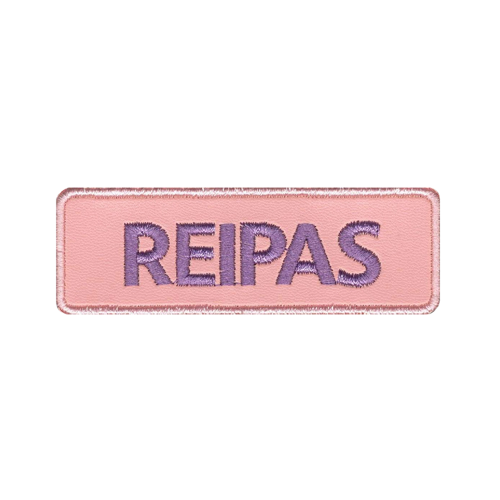 Nahkamerkki, vaaleanpunainen, teksti: reipas.