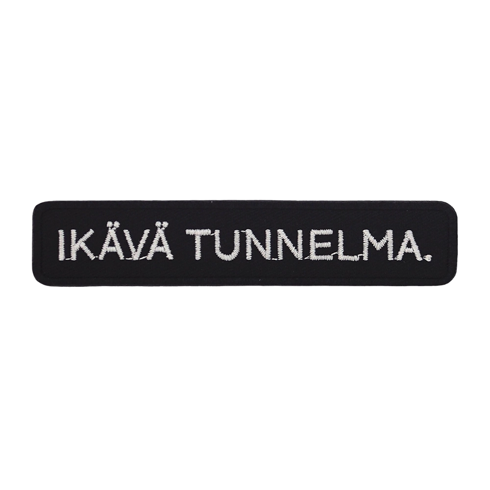 Brodeerattu kangasmerkki, teksti: Ikävä tunnelma.