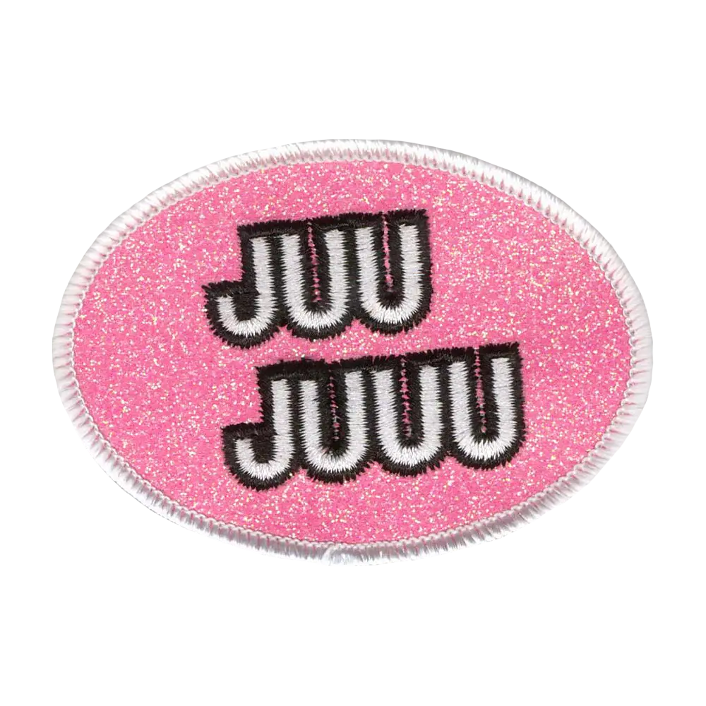 Brodeerattu glitterkangasmerkki.