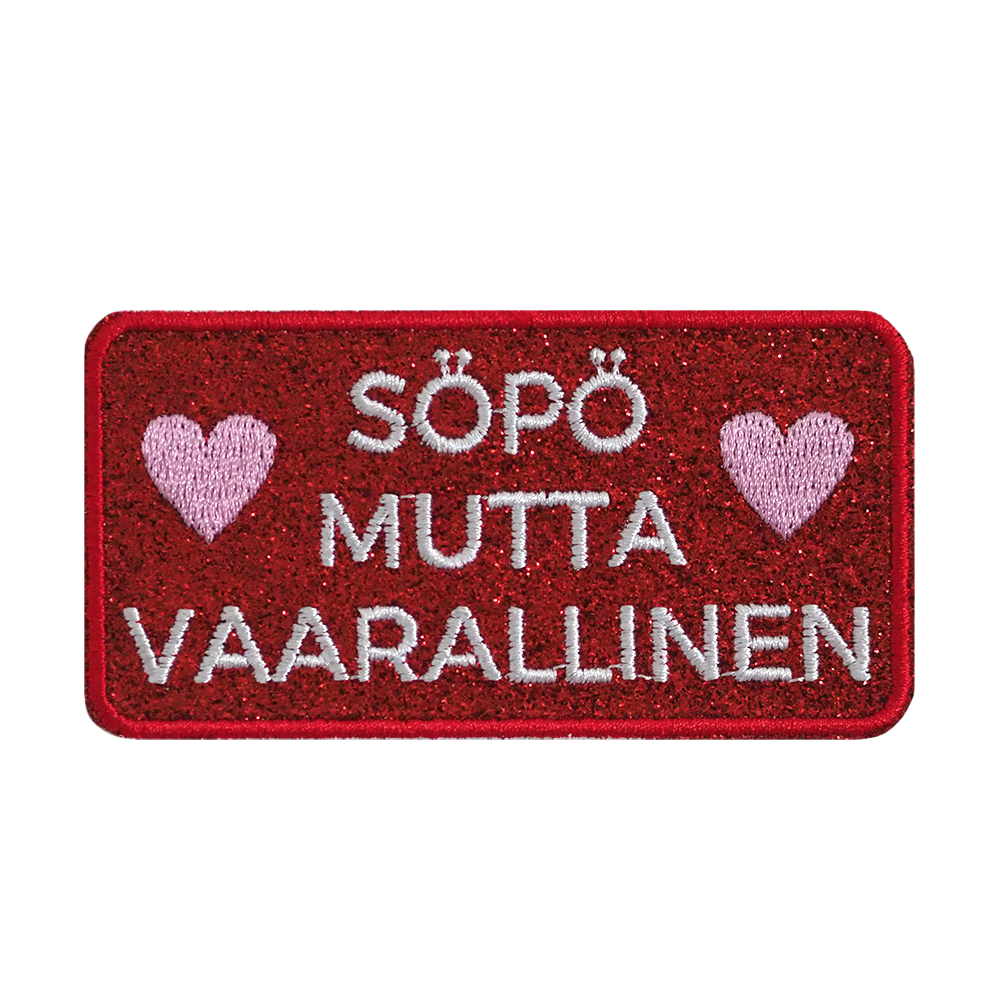 Brodeerattu glitterkangasmerkki.