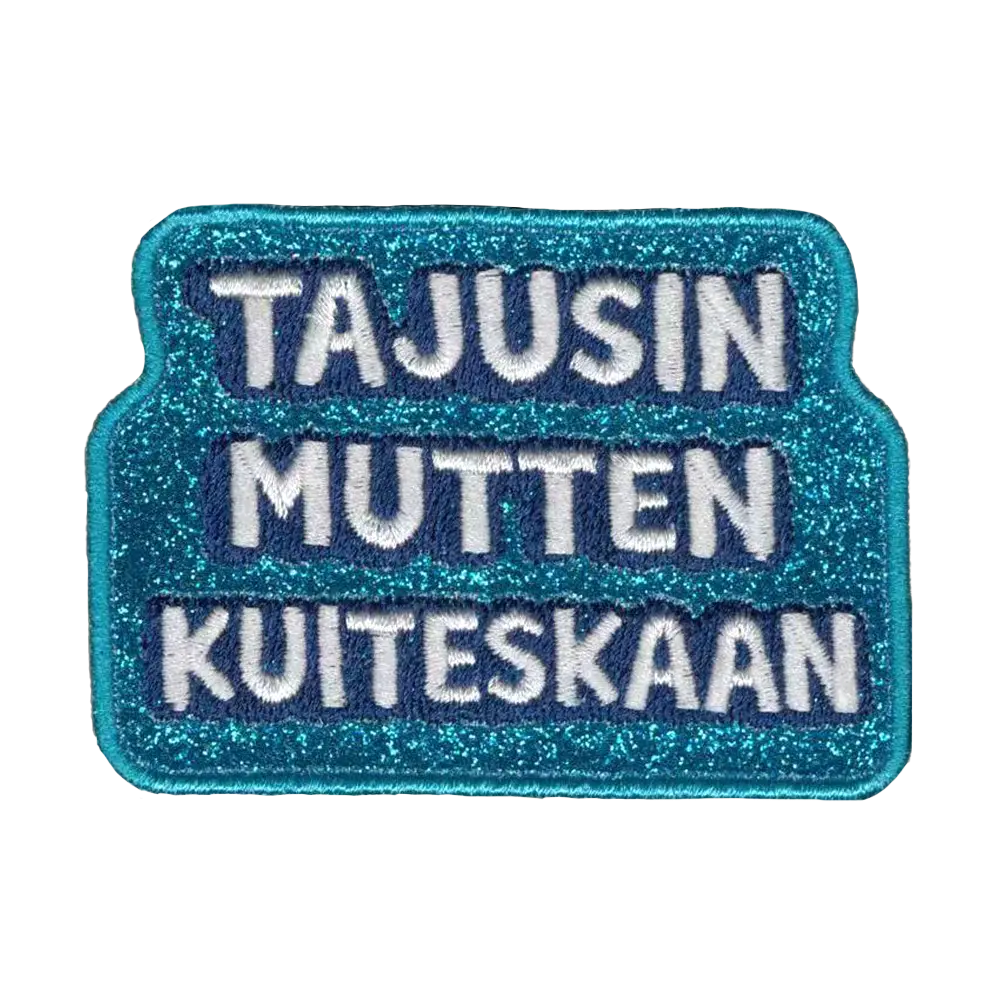 Brodeerattu kangasmerkki, sininen glitterkangas.