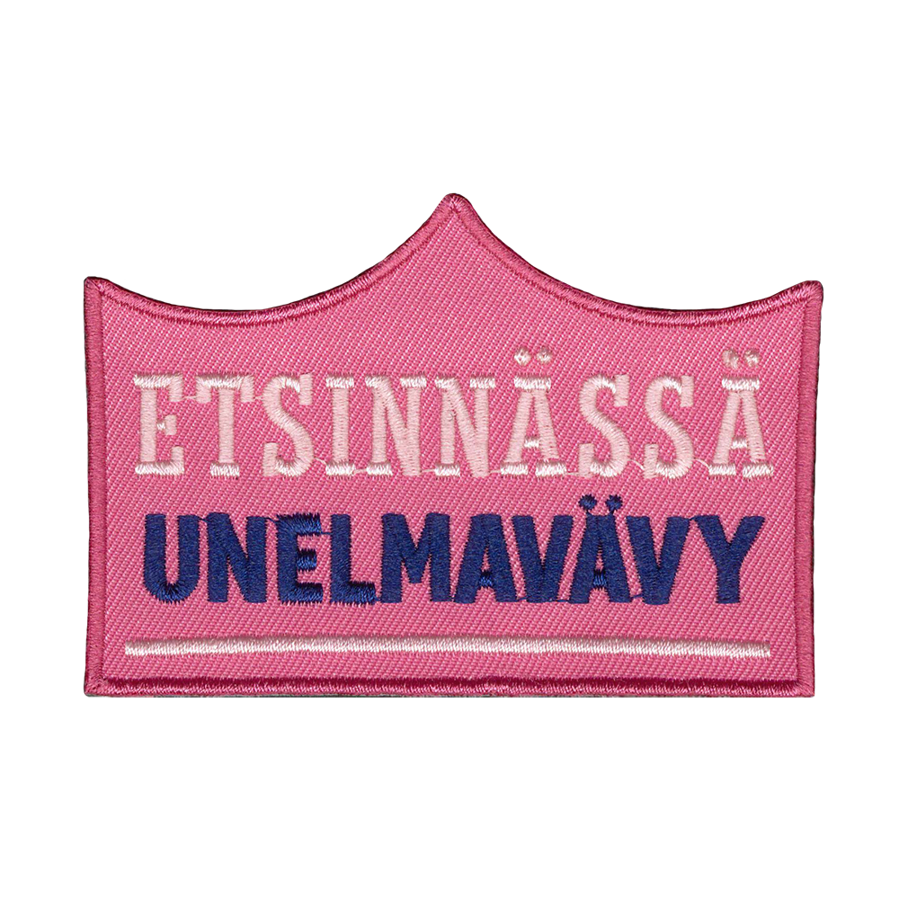 Brodeerattu kangasmerkki, teksti: etsinnässä unelmavävy.