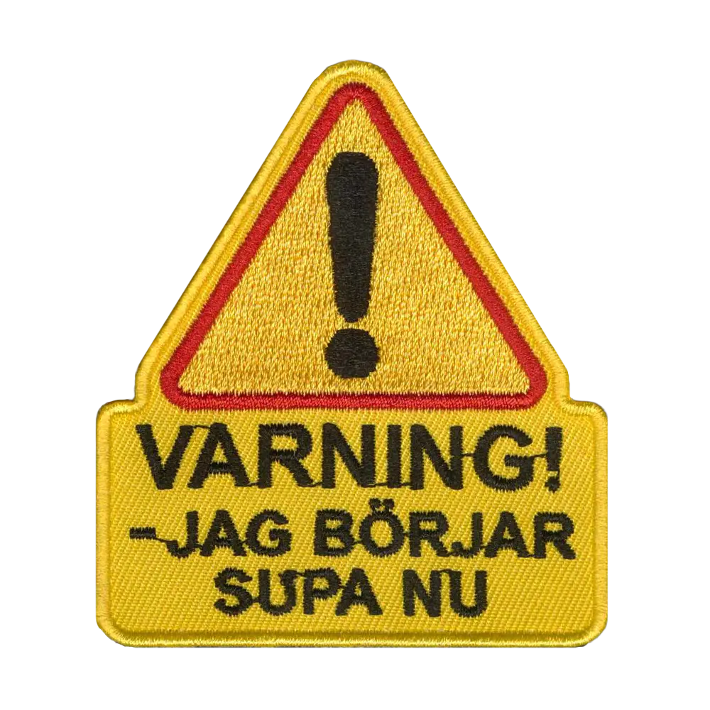 Brodeerattu kangasmerkki, varning.